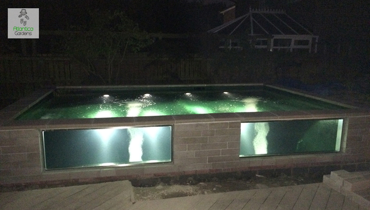 Koi pond with two large stainless pond windows 